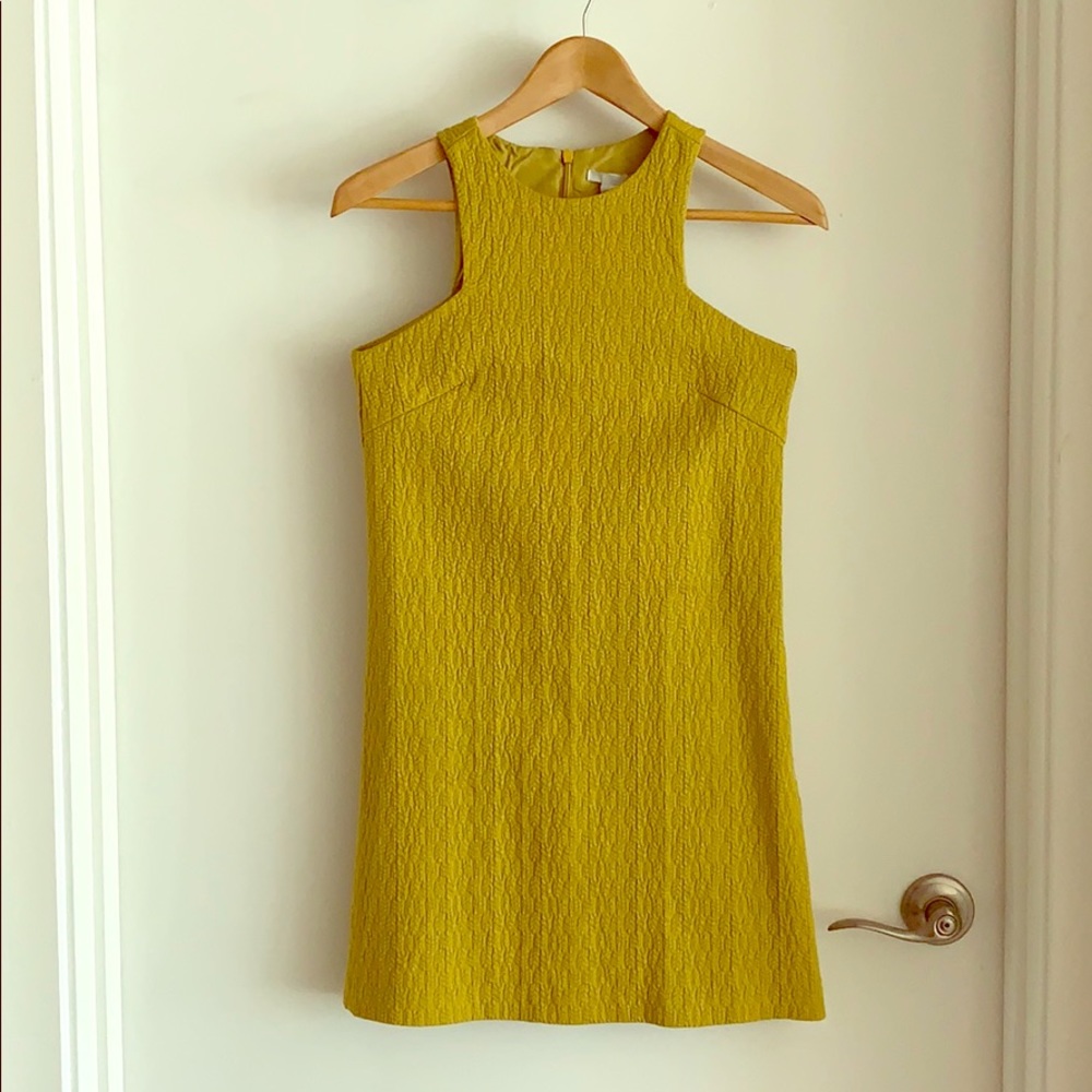 High neck dress. Semi-lined. Fits true to size